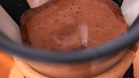 kemex, pouring water on coffee, extreme close up