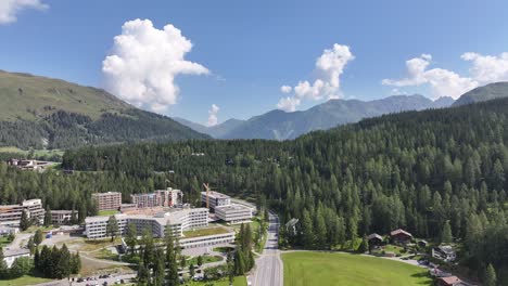 aerial drone view of kanton graubünden, schweiz- houses settlement along the kanton graubünden, schweiz lake