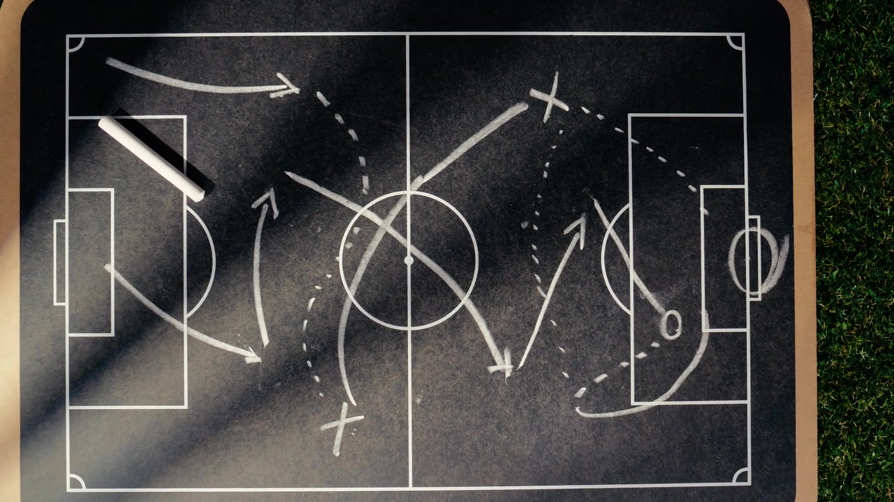 Tactical scheme of football match on blackboard