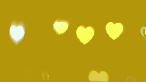 blurred hearts on golden background