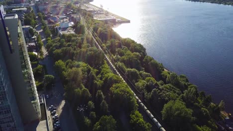 aerial view of city riverfront with train