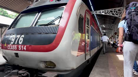 sri lankan commuter train at a railway station