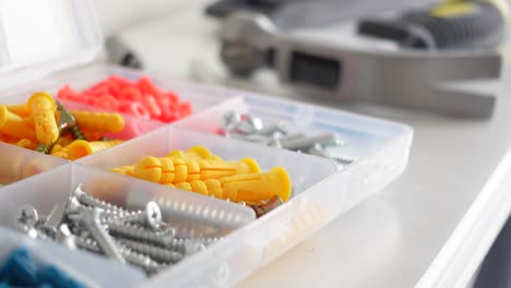 assorted hardware and tools in an organizer