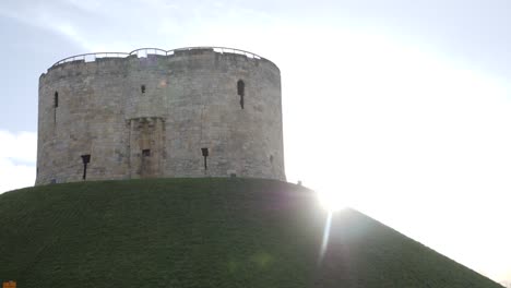 york clifford tower with sun flare, slow motion