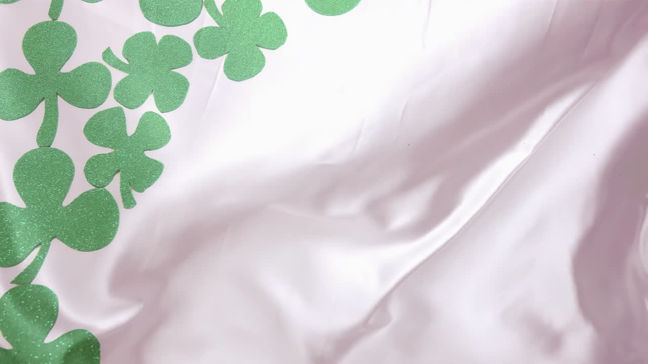 Animation of green clover leaves with copy space on white background