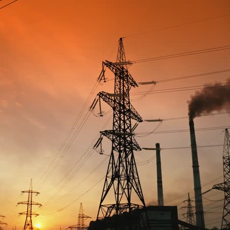high voltage power station. high voltage electric line during sunset