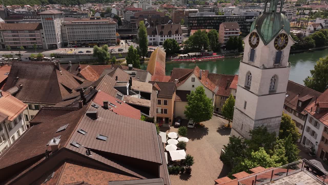 Aerial view of Olten clock tower and historic rooftops with river backdrop in Switzerland