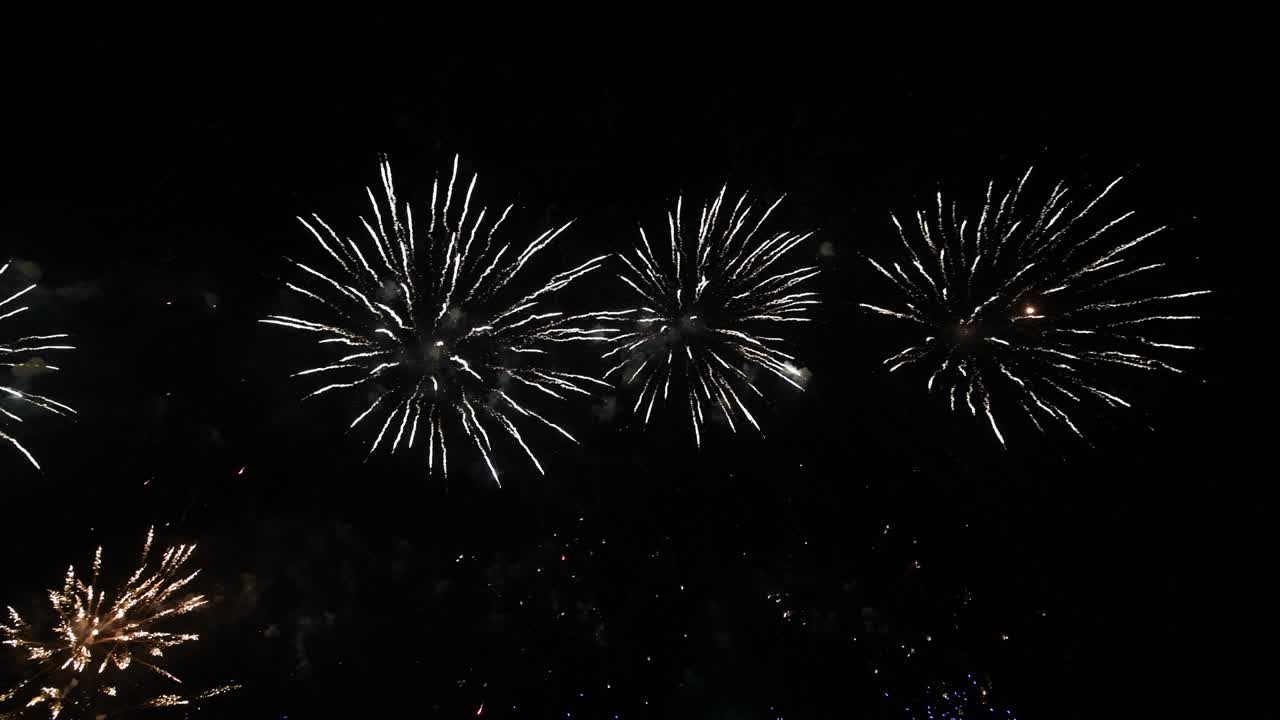 4K long time seamless loop of real colourful fireworks festival in sky display at night during national holiday, new year party 2022