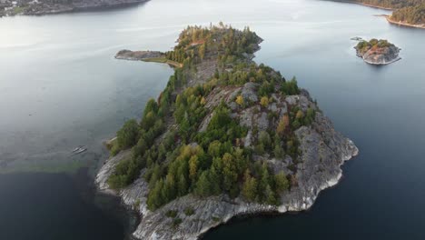 flight over a lone island in swedish fjord