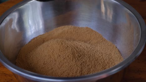 Pouring-Cracker-Crumbs-Into-Bowl