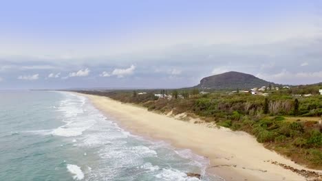 Aerial-drone-slow-travelling-shot-looking-South-along-the-coast-towards-Mt-Coolum