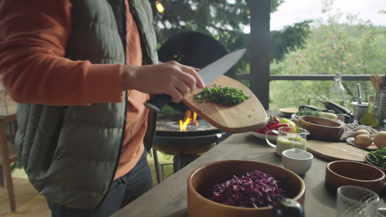 Food Blogger Cooking Salad on Barbecue Terrace