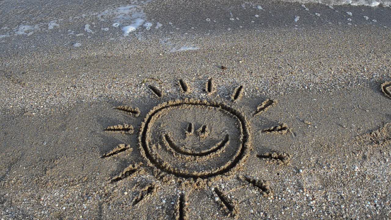Sun drawing on the beach. Beach and drawing