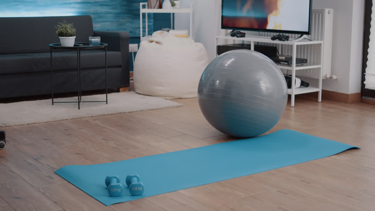 Empty living room with equipment used for physical exercise