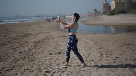 woman taking a video on the beach