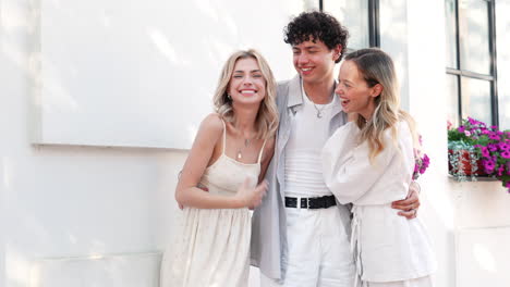 three friends laughing outdoors