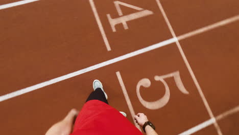 first-person perspective of walking and running on a track