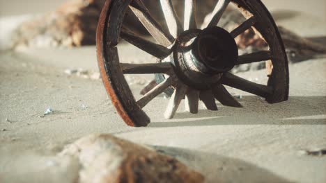 Large-wooden-wheel-in-the-sand