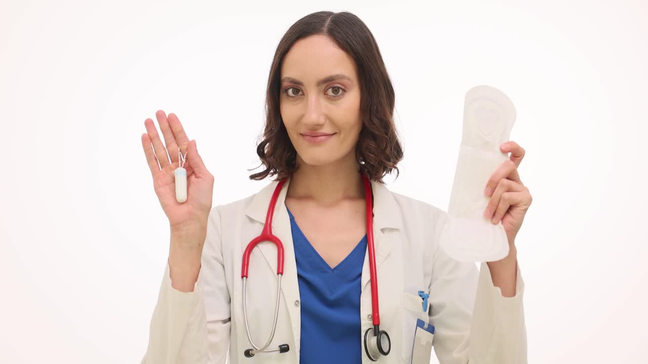 Female Doctor Presenting Tampon and Sanitary Pad