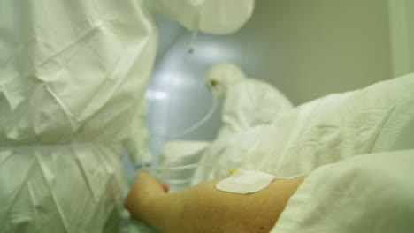 patient with iv drip being transported by paramedics