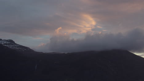 sunrise from the ship on the mountain side in hardanger, hardangerfjorden in early morning