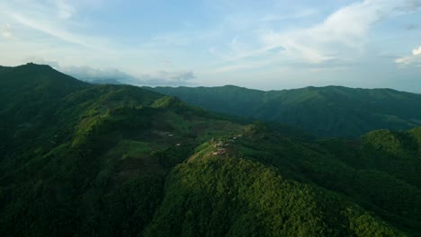 4K-Cinematic-nature-aerial-footage-of-a-drone-flying-over-the-beautiful-mountains-of-Chiang-Mai,-Thailand-during-sunset