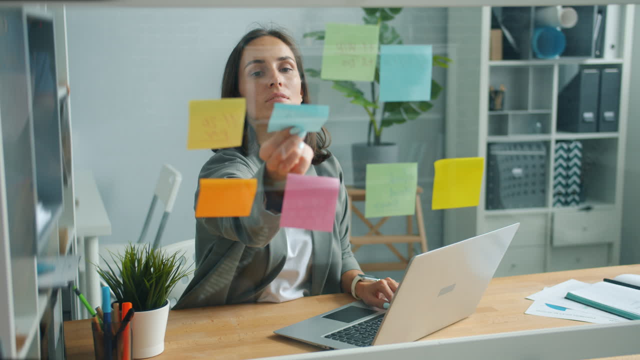 Woman Working on Laptop in Modern Office