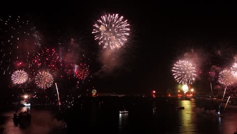 panoramic aerial view of the coast of valparaiso at night with the fireworks festival at night, coordination of boats at night chile - new year's eve festival