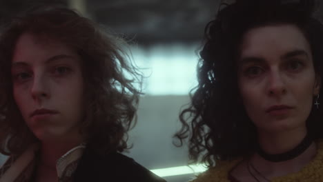 two women looking intently at the camera