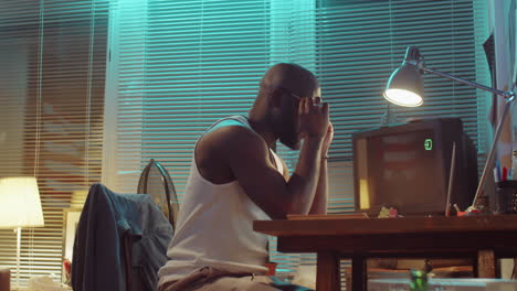 African-American-Man-Working-on-Laptop-Late-at-Home