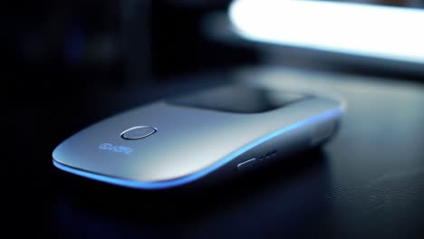 a close-up view showcases the elegant design and functions of a computer mouse suitable for daily tasks. the mouse features a sleek build and innovative lighting, enhancing user experience.
