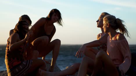 Female-volleyball-players-relaxing-in-the-beach-4k