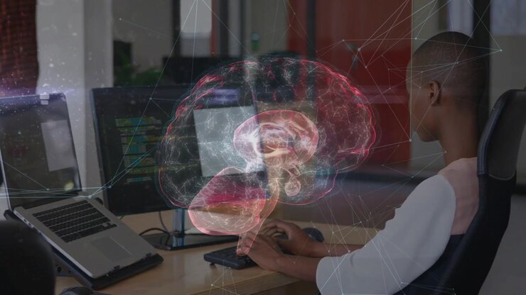 Seated woman typing while monitor code launching AR brain rotating revealing tech layers over hands