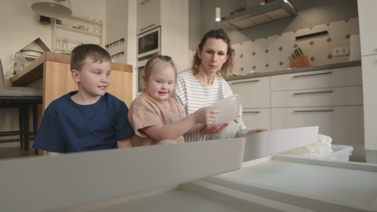 Family Organizing Kitchen Items