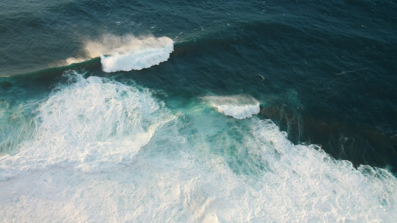 Aerial View of Powerful Ocean Waves Crashing