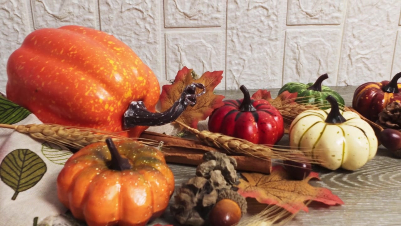 Autumnal thanksgiving day background with pumpkins and leaves