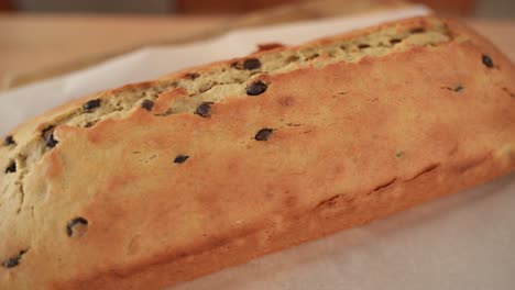 close up of homemade chocolate chip bread loaf, turn on wooden background