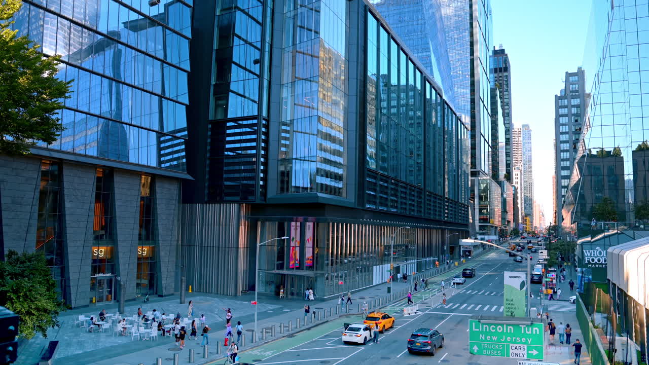 New York, USA, 16 July 2025: Modern glass skyscraper in New York City.. A tall glass skyscraper in Manhattan reflecting the city environment