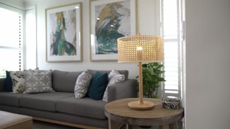 real estate shot of lamp zoom out in living room in bright airy space