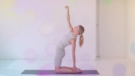 practicing yoga, woman stretching on mat with colorful bokeh animation