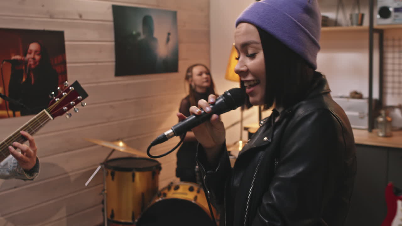Girl From Music Band Singing To Microphone