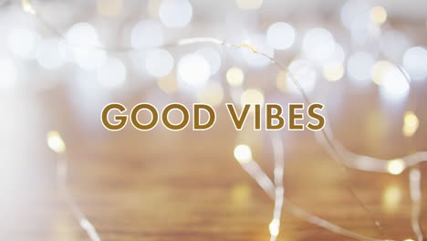 animación de buenas vibraciones texto sobre luces de navidad
