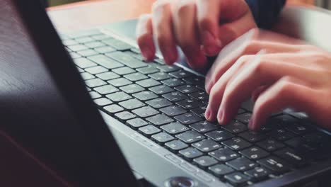 close-up of hands of unrecognizable business man typing on laptop keyboard 01