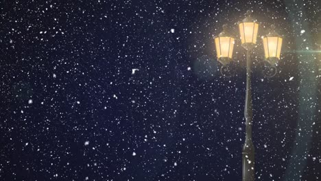 animation of snow falling and street lamp at christmas