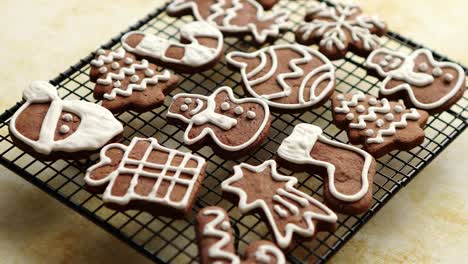 fresh baked christmas shaped gingerbread cookies placed on steel grill