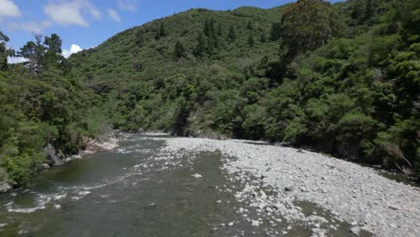 a drone shot of a river flowing through a valley