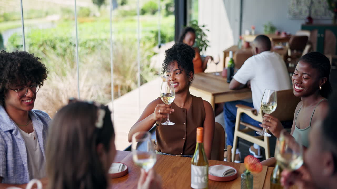 Happy Diverse Group of Friends Toasting with Wine in a Modern Restaurant