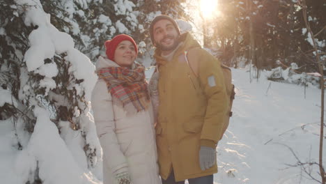 couple hiking in a snowy forest