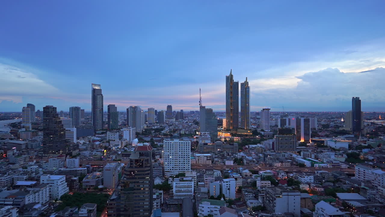 Pan across the skyline of Bangkok at the blue hour