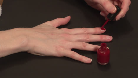 stock footage of a woman painting her nails